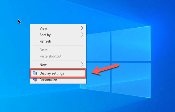 Right-click on your desktop and select Display settings.
Scroll down and click on Graphics settings.